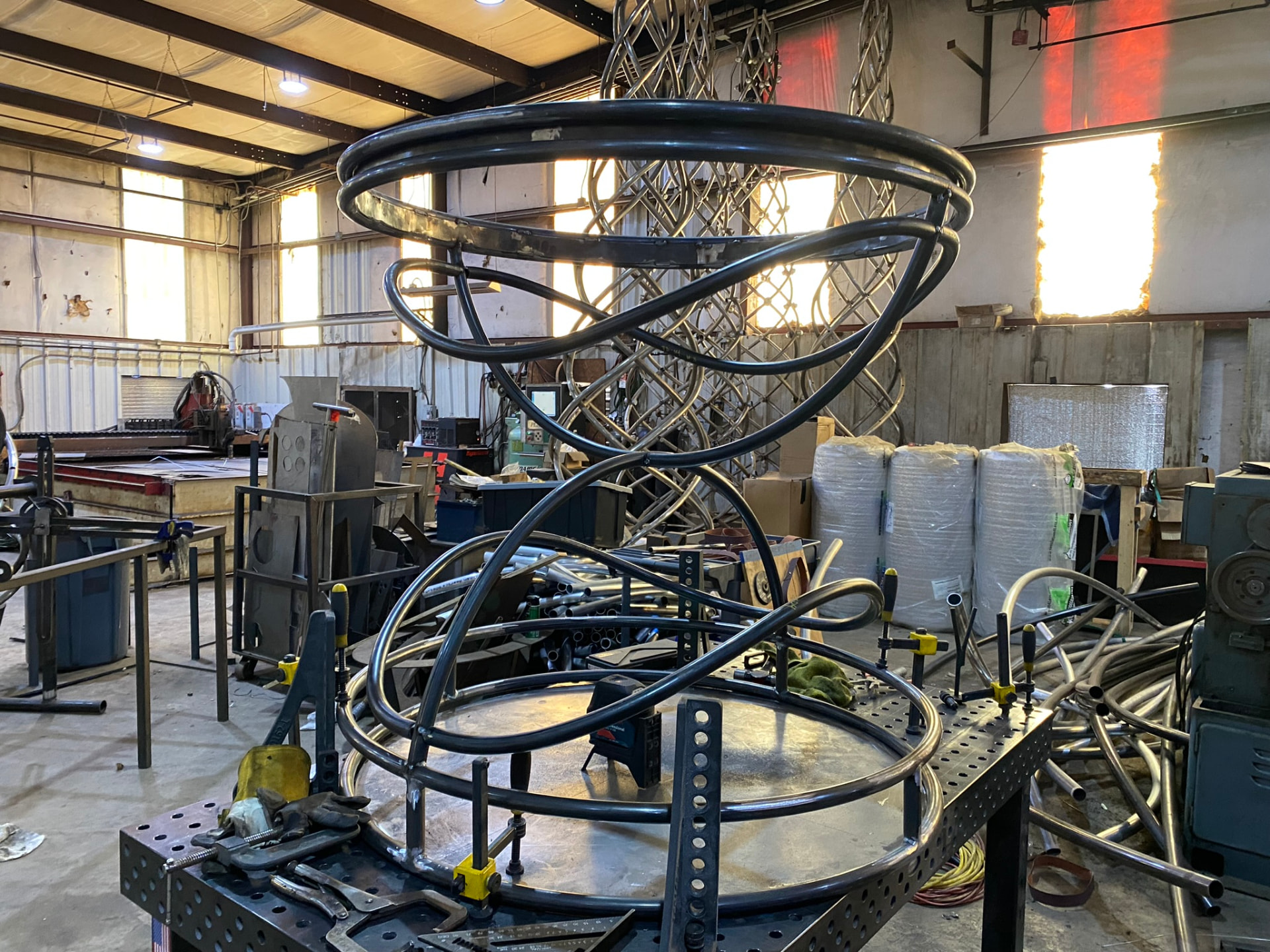 Assembled twisting arc structure of the hero pedestal clamped in its fixture
