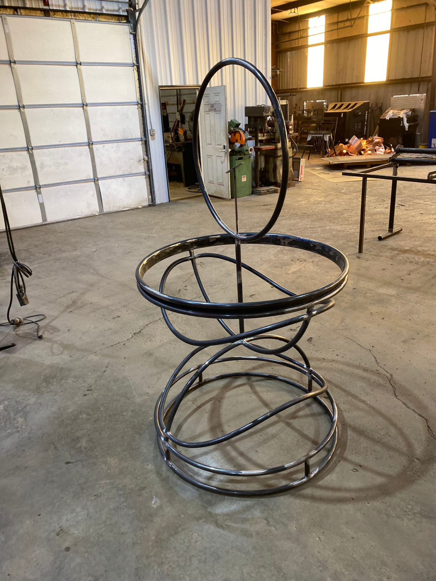 Completed hero pedestal frame with crown ring standing on the shop floor