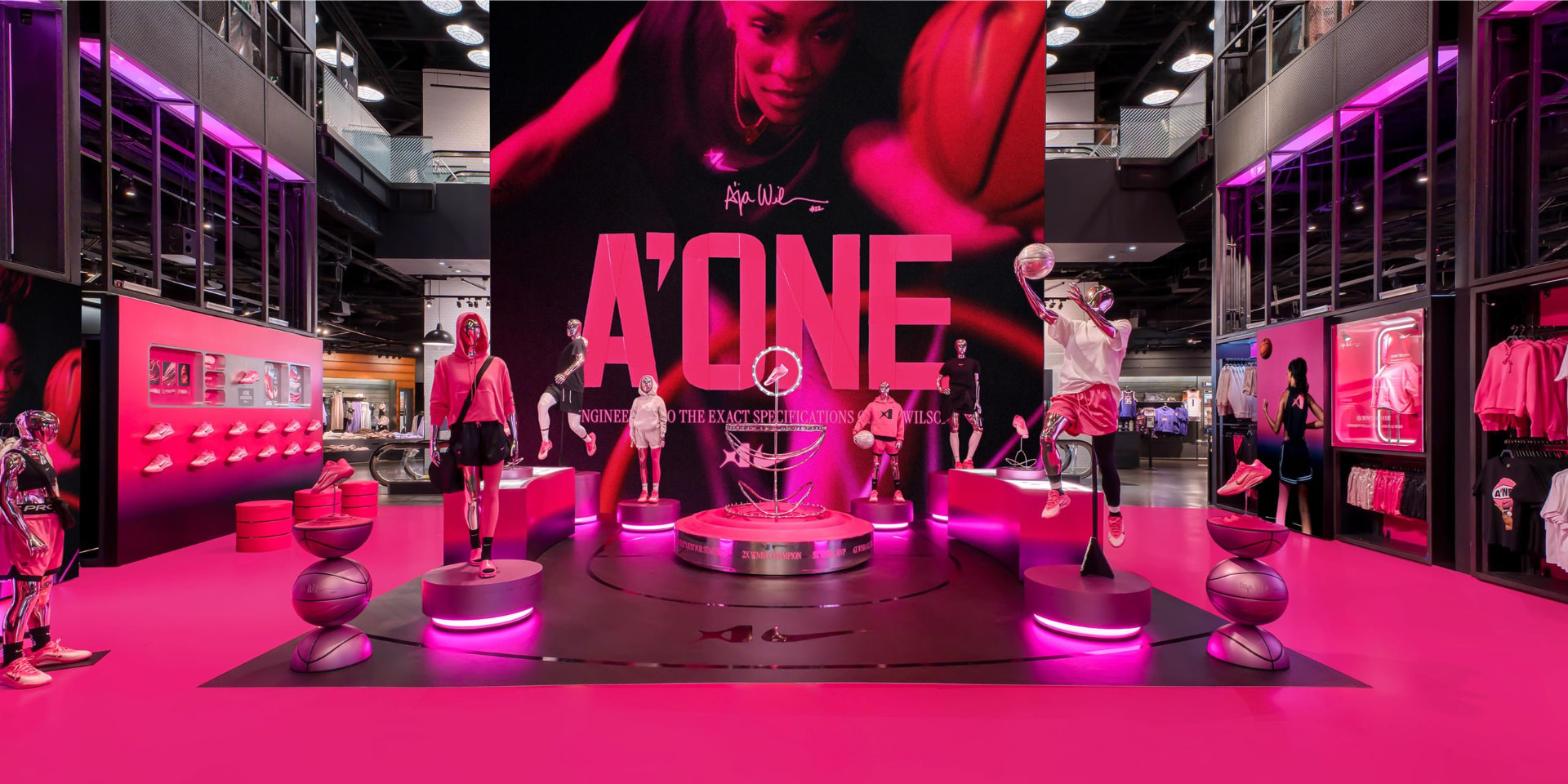 Completed Nike A'One floor displays lit in magenta inside the store