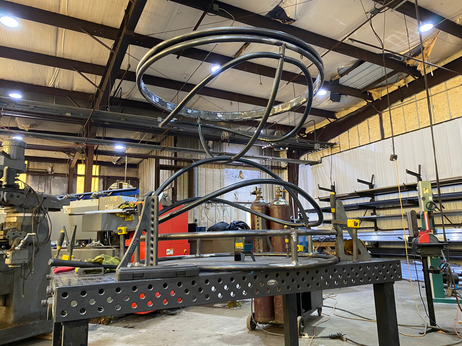 Pedestal armature fixtured on the welding table with its upper crown ring aligned