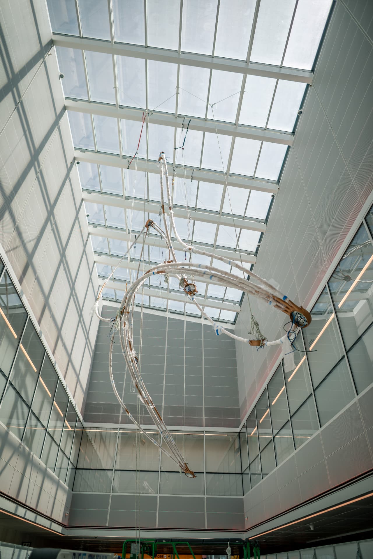 Sculpture section suspended in the atrium shaft below the skylight