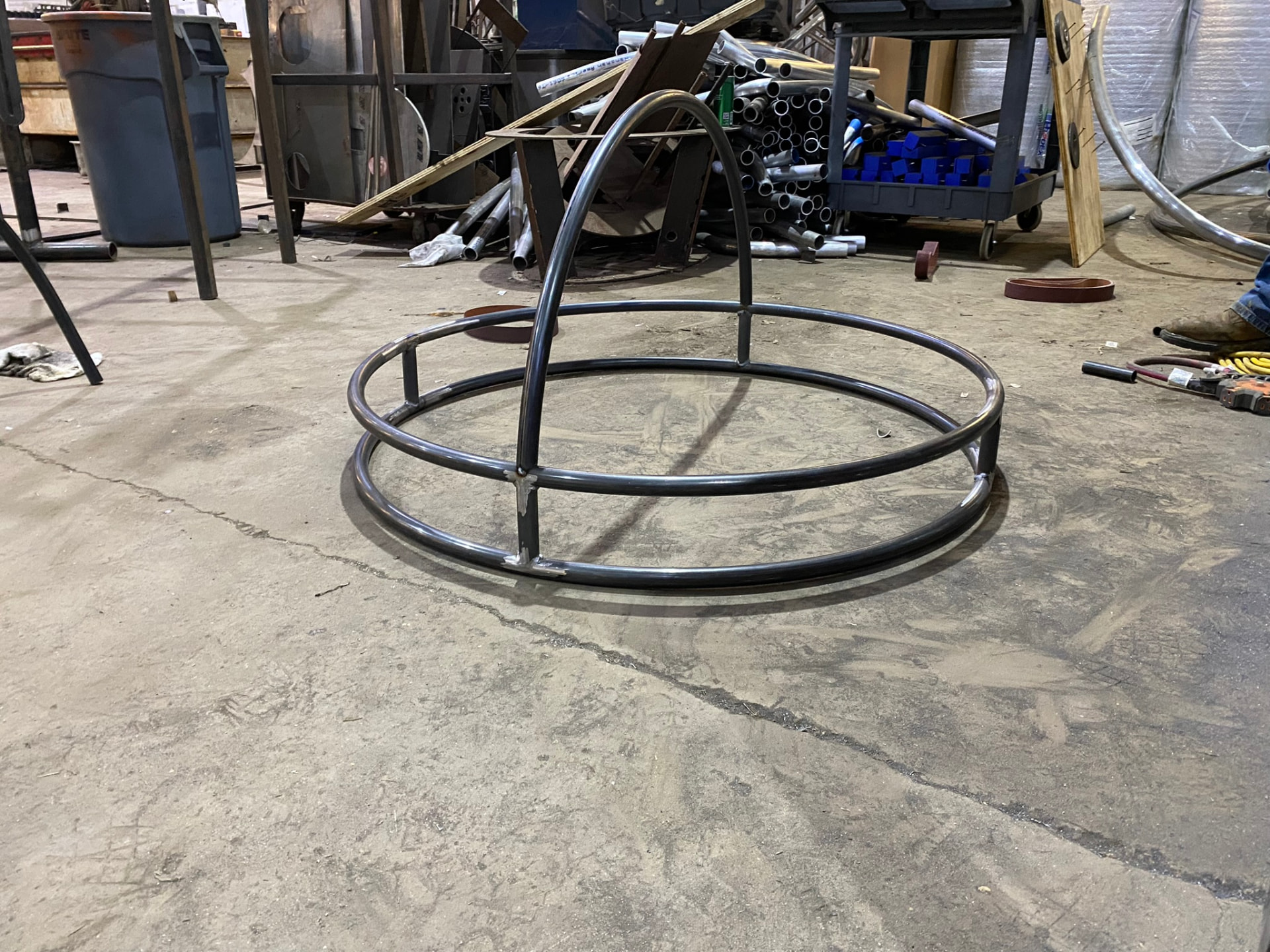 Pedestal base ring with the first vertical arc tacked into position