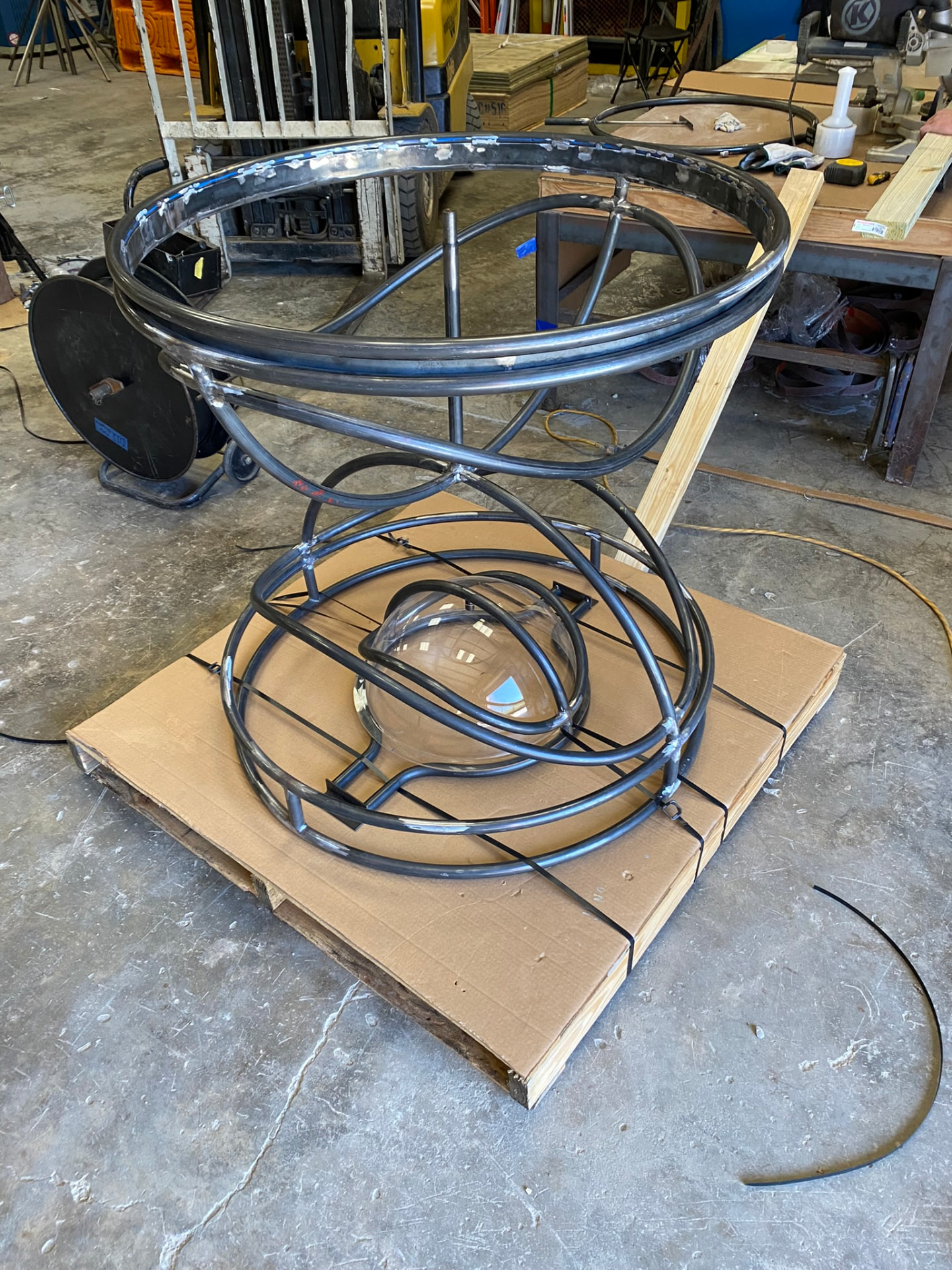 Finished pedestal frame crated with the clear acrylic dome nested inside