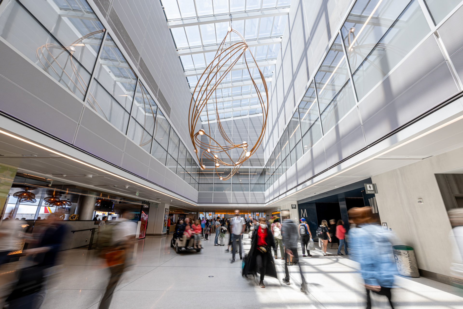 Constellations sculpture suspended above travelers in the Concourse C atrium